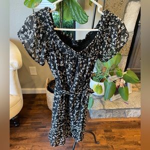 Bardot floral, black, and white dress.